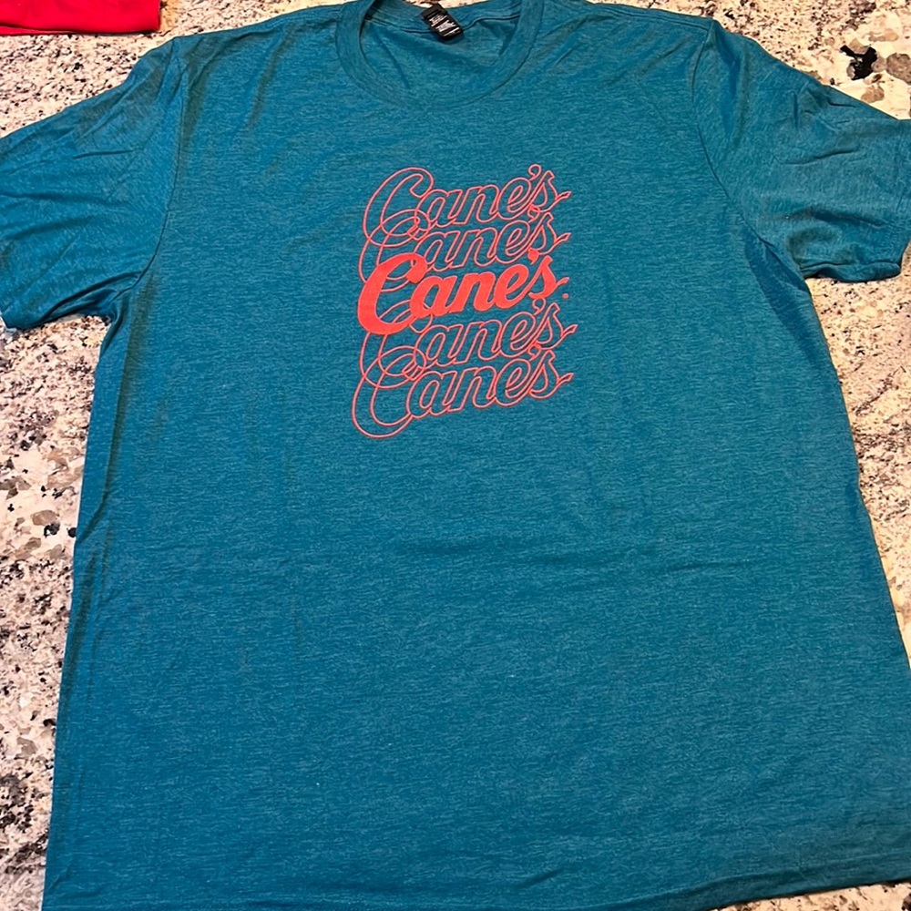 Canes, teal and red T-shirt in a size XL